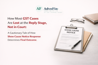 A Show Cause Notice on a clipboard with a pen, reading glasses, and documents — illustrating how most GST cases are lost at the reply stage itself, not in court - AdvoFin Consulting Pvt. Ltd.